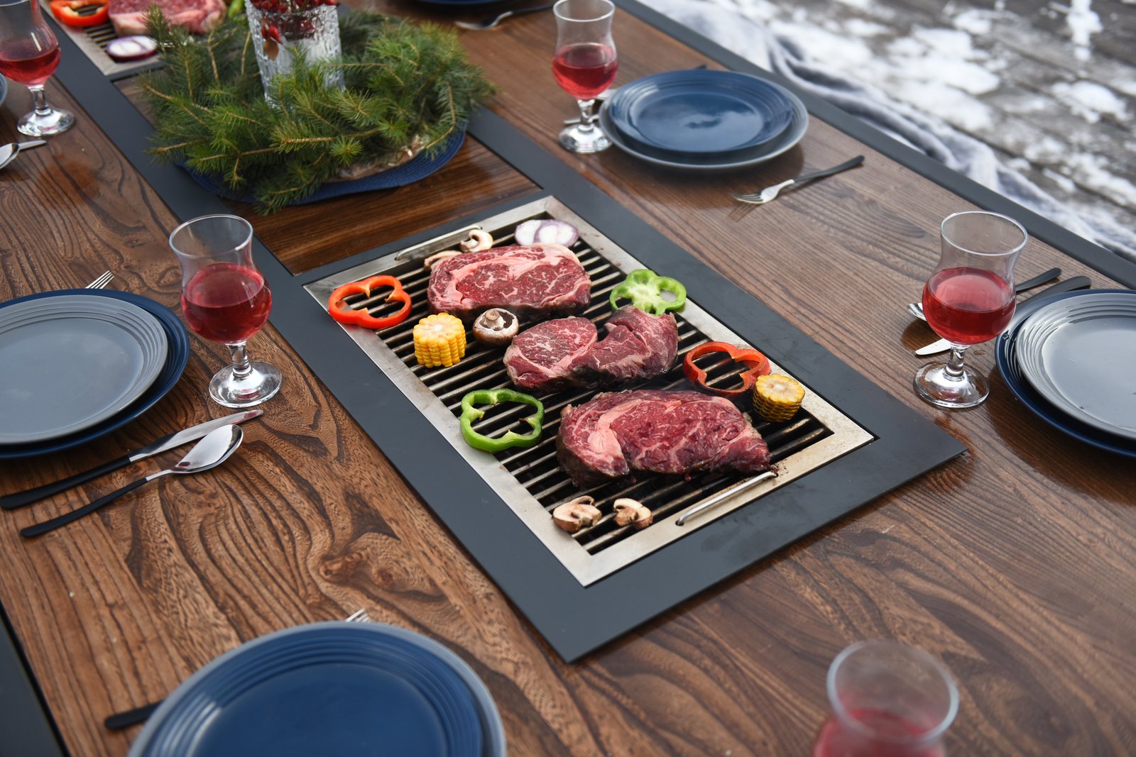 Steaks and vegetables on the King's Table built-in grill