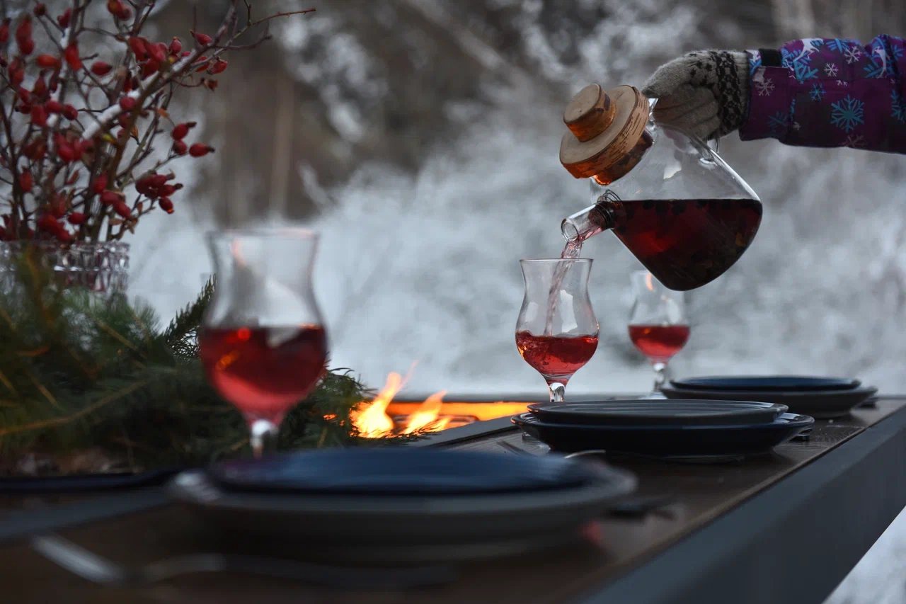 King's Table: wine in a decanter, berries, fire down the center