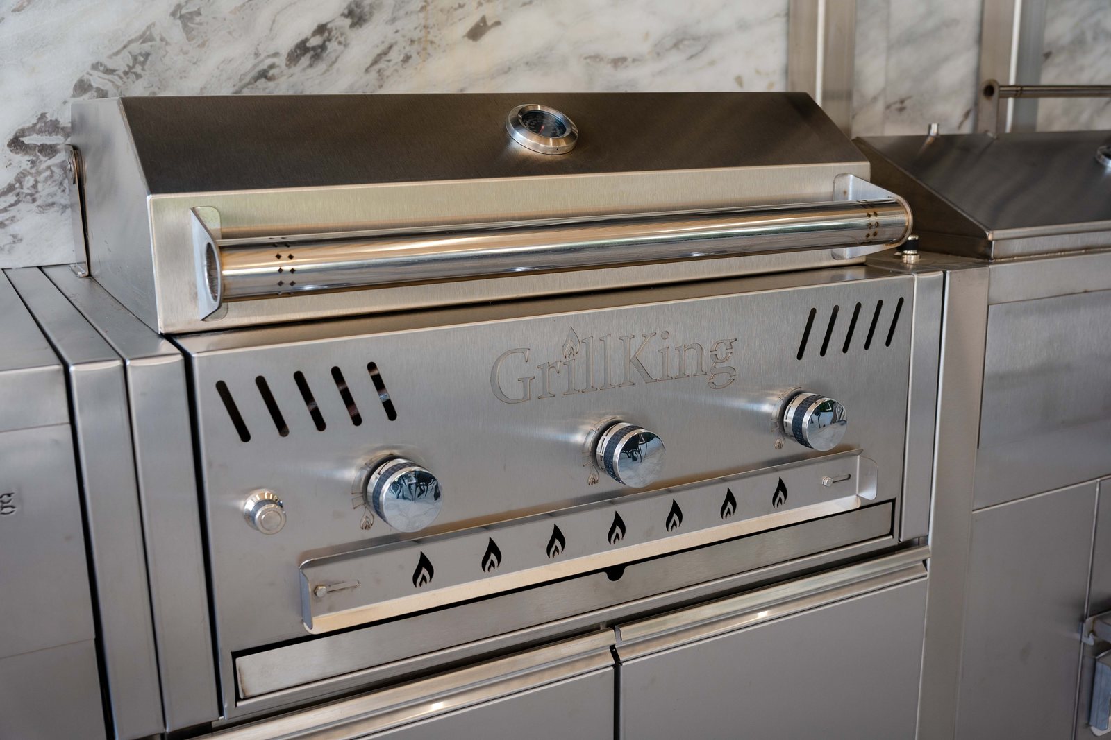 A GrillKing gas grill in the kitchen run