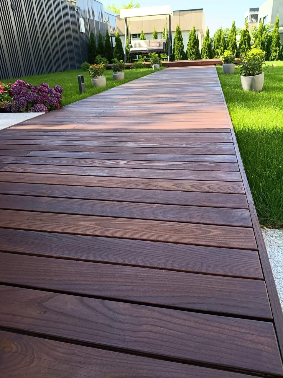 A thermowood terrace holding an even, deep color after care